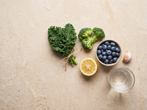 Fresh vegetables, fruit and water on a table