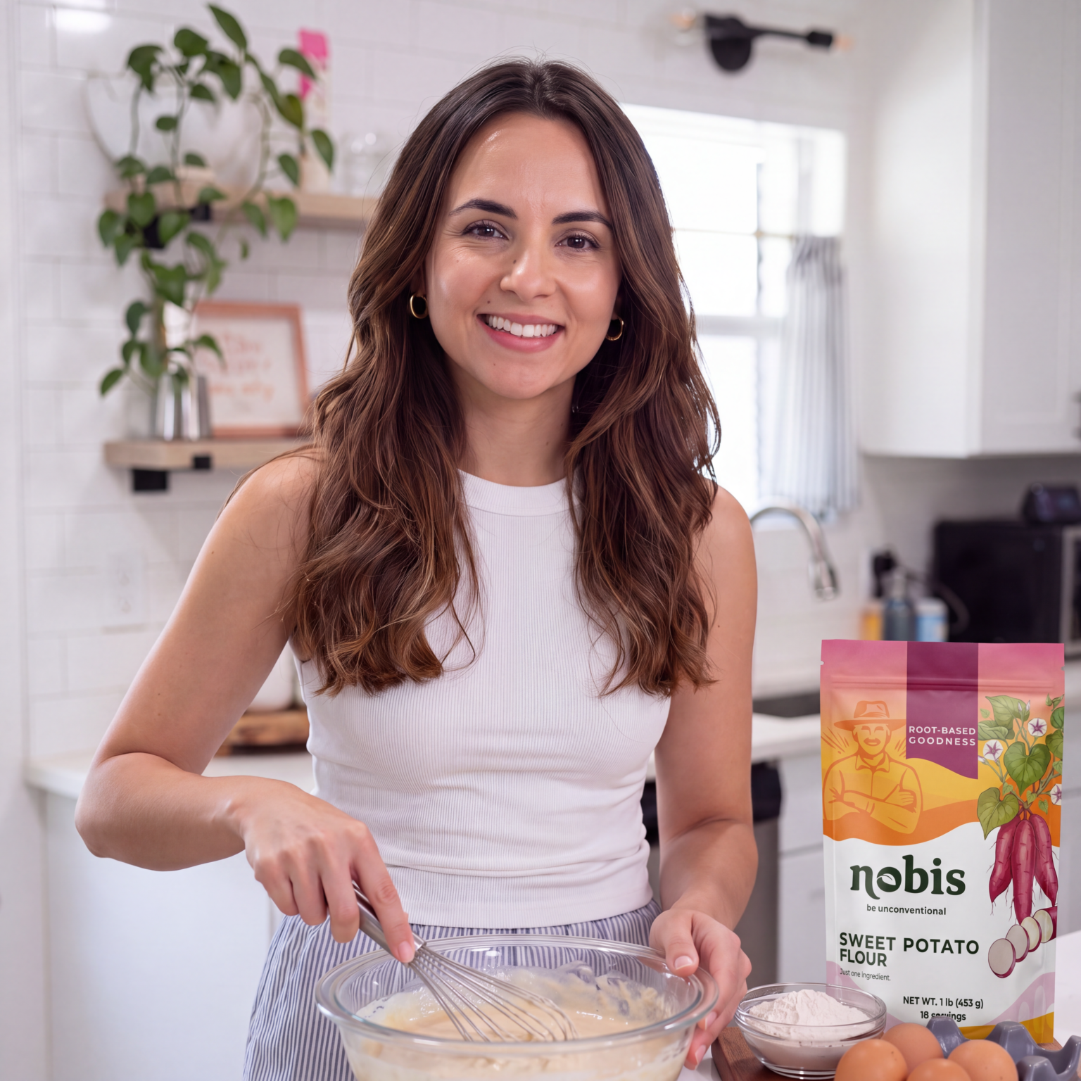 Elza Altvater Conn, founder of nobis, whisking batter with sweet potato flour