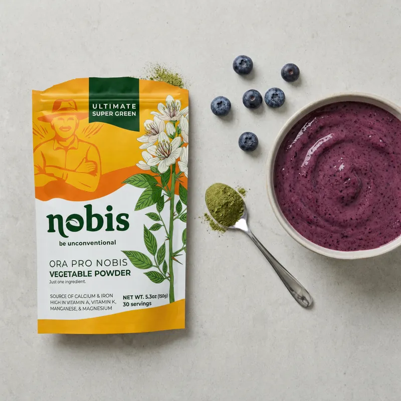 An opened pouch of ora pro nobis powder next to a blueberry smoothie bowl
